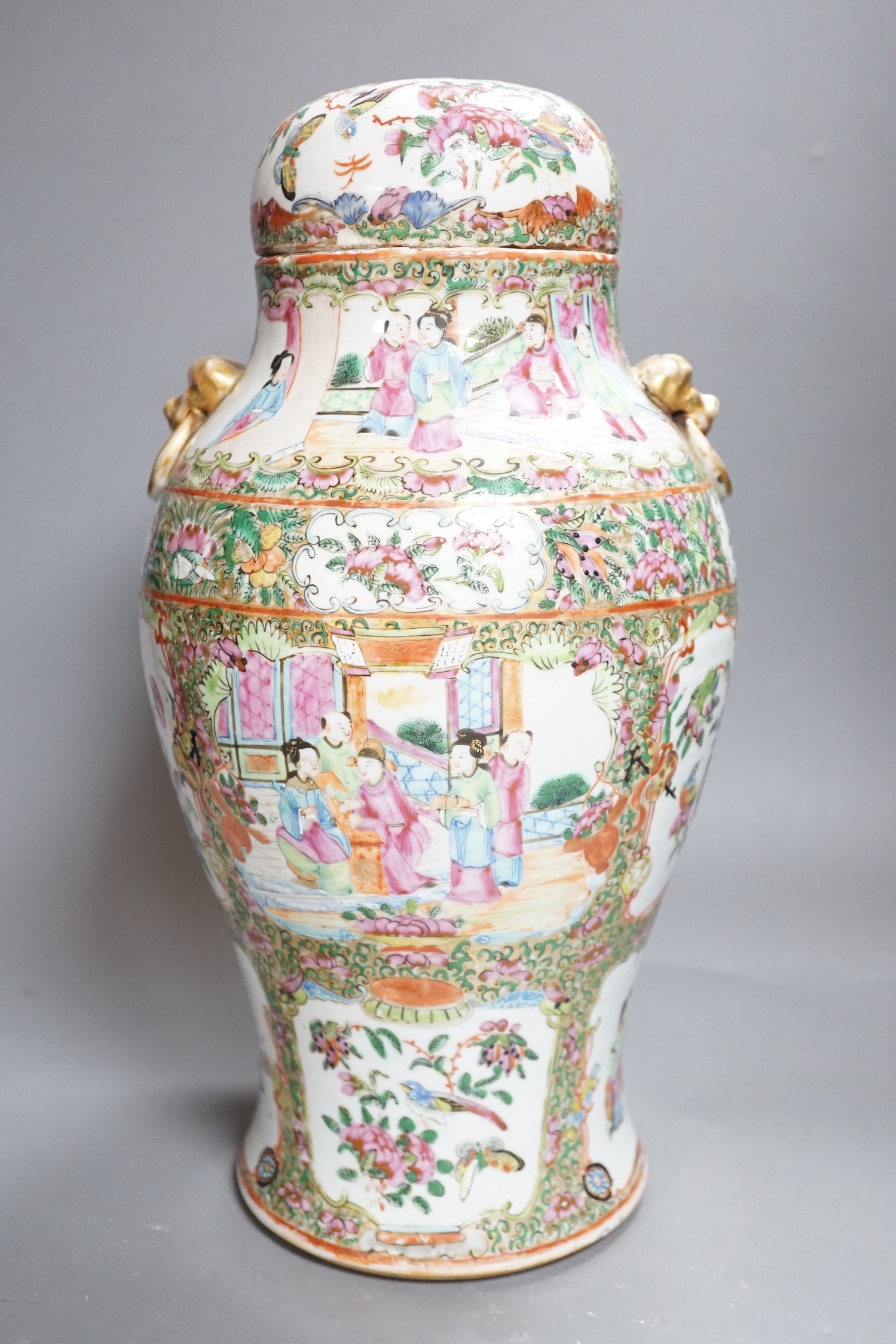A 19th century Cantonese famille rose baluster vase and cover, the latter lacking a knop finial, 38cms high
